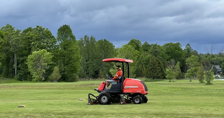 Kurt cutting the grass at Ironwoods Golf Course